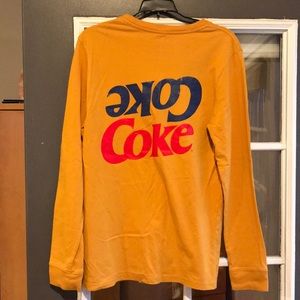 Mustard color long sleeve men’s t-shirt.